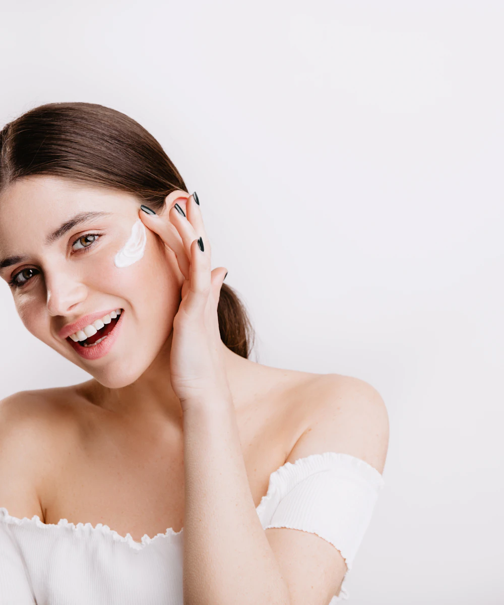 A client smiling with fresh, glowing skin